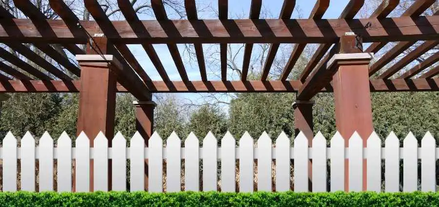 how close can you build a pergola to a fence