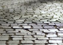 outdoor shower cobblestone path