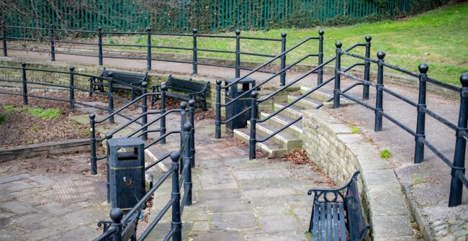 stacked stone and metal fencing